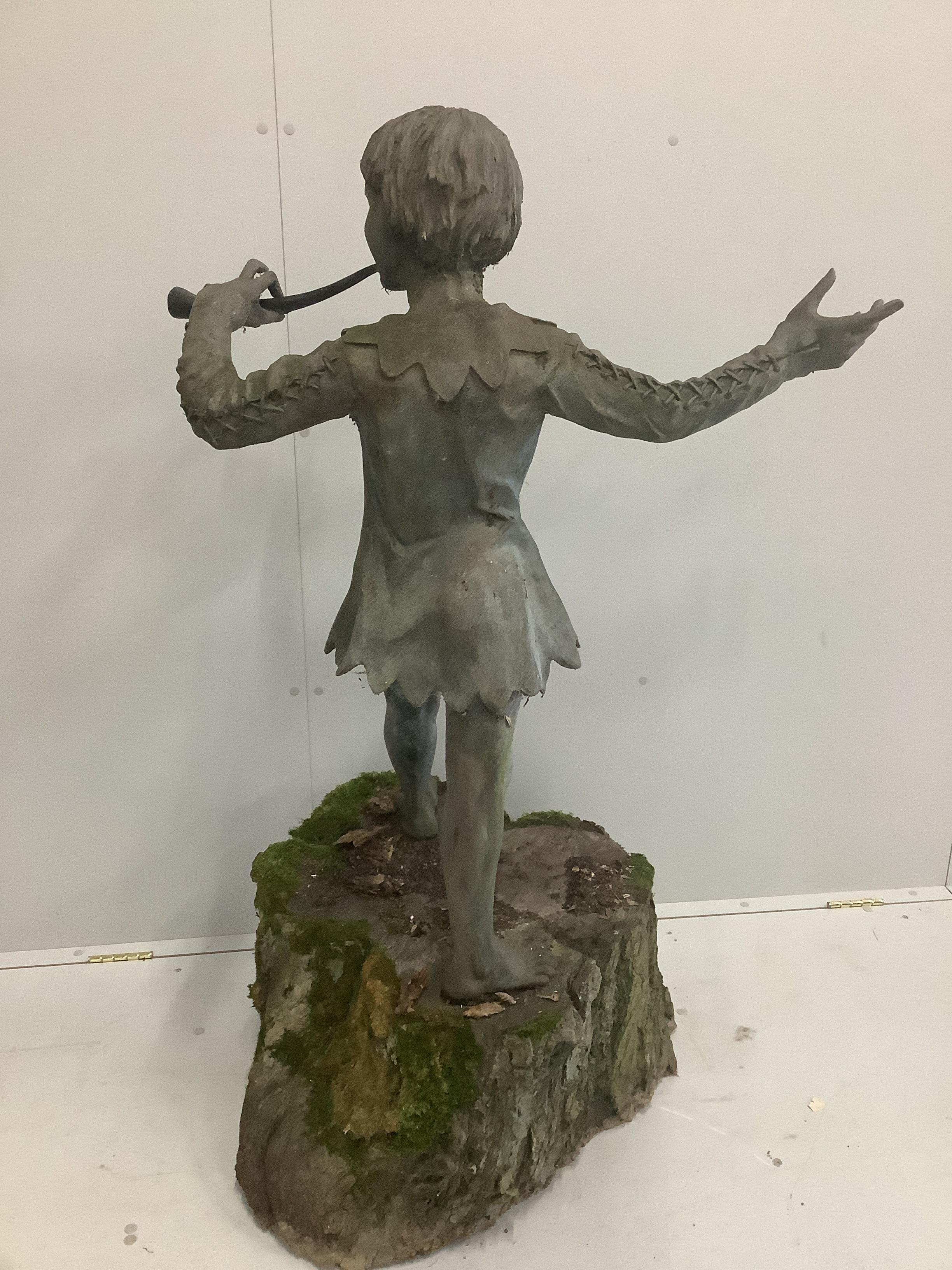 Everard Meynell (b.1950), simulated lead composition garden statue of Peter Pan, mounted on natural tree trunk plinth, height 100cm, height overall 135cm